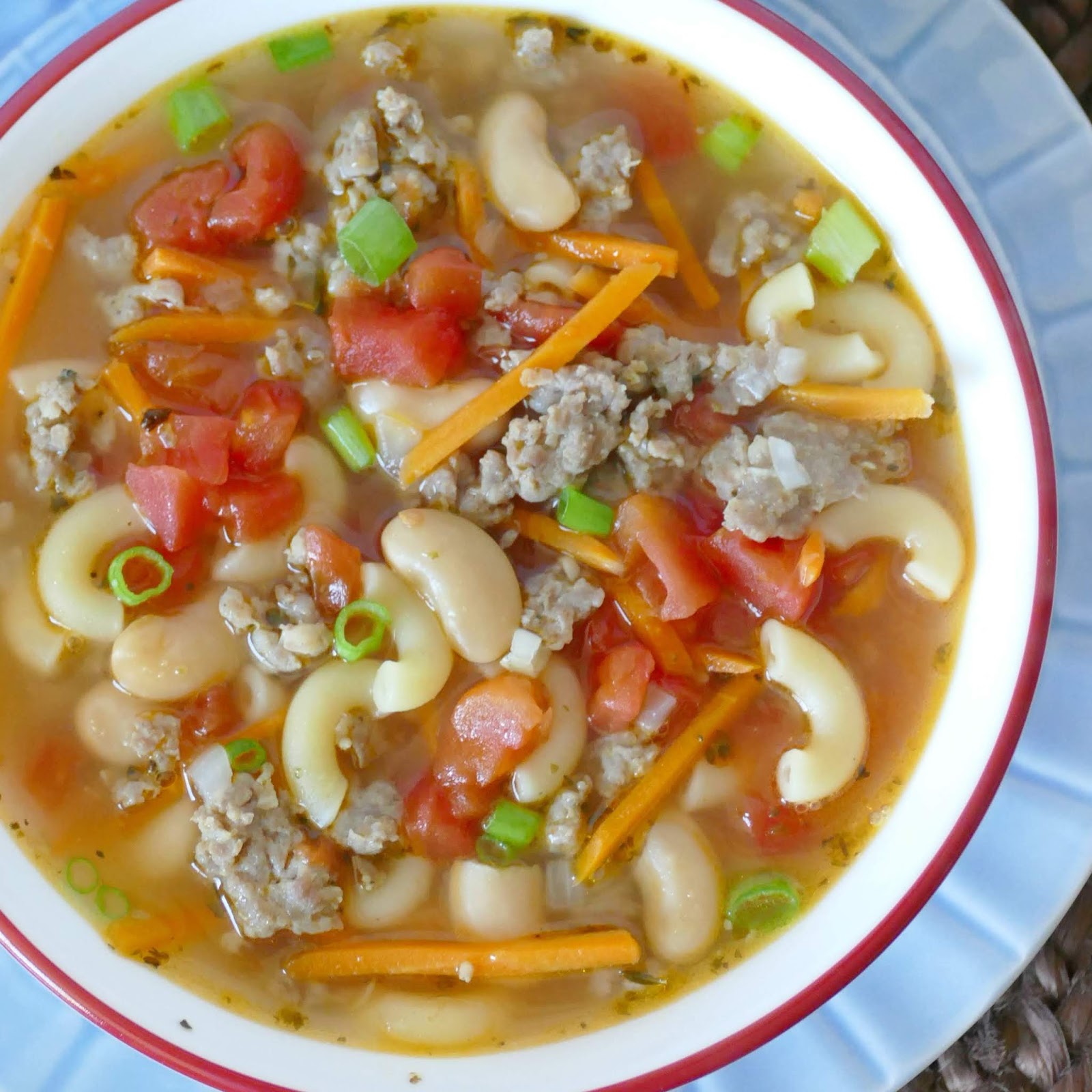 This hearty and delicious soup is budget friendly, freezer friendly and a crowd pleaser! Combine macaroni pasta, diced tomatoes, canned beans, and shredded carrots with ground pork for a great lunch or dinner!