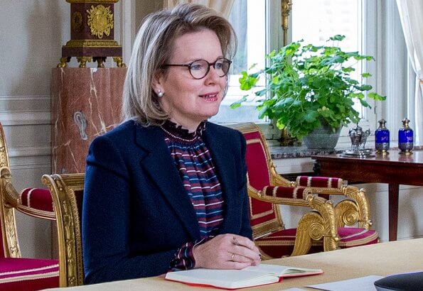 Queen Mathilde wore a striped blouse from Natan Spring Summer 2018 collection and  striped trousers from Natan. Armani navy blue blazer