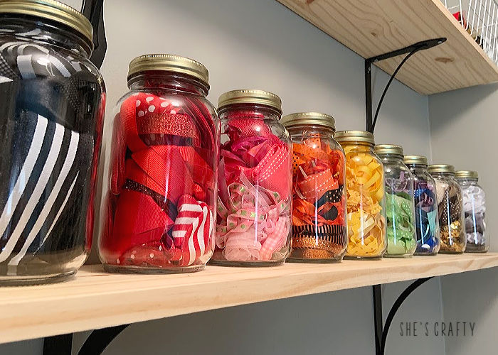 6 essentials to have in any craft room- glass jars to storage ribbon on shelves