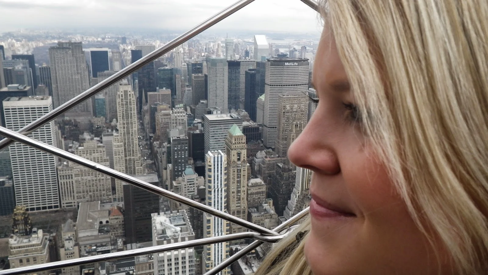 woman face in front of New York skyline