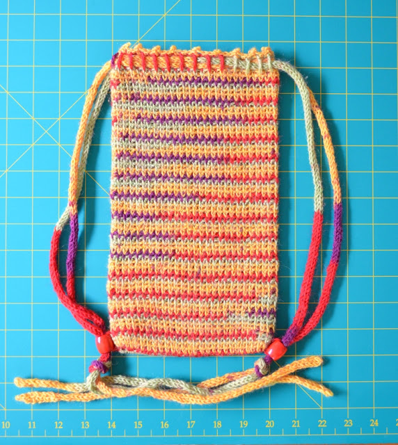 WIP Project Bag laid out flat onto cutting mat grid to show dimensions.