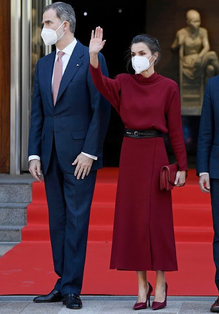 Queen Letizia wore a limited edition burgundy red open back dress from Massimo Dutti