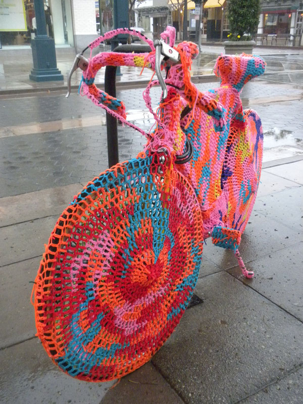 a curious gardener yarn bombing/ graffiti knitting