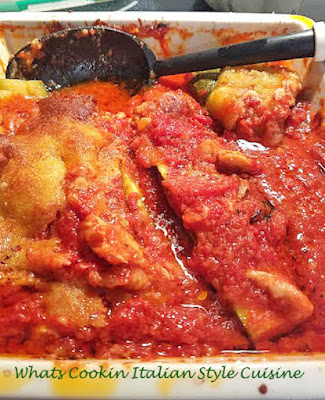 This is stuffed zucchini with a chicken and tomato sauce baked