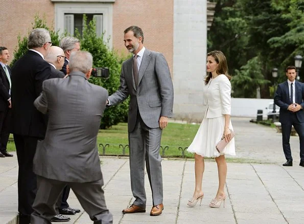 Queen Letizia wore BOSS HUGO BOSS Jeisana Textured Peplum Jacket. Felipe Varela clutch bag and Magrit sandals