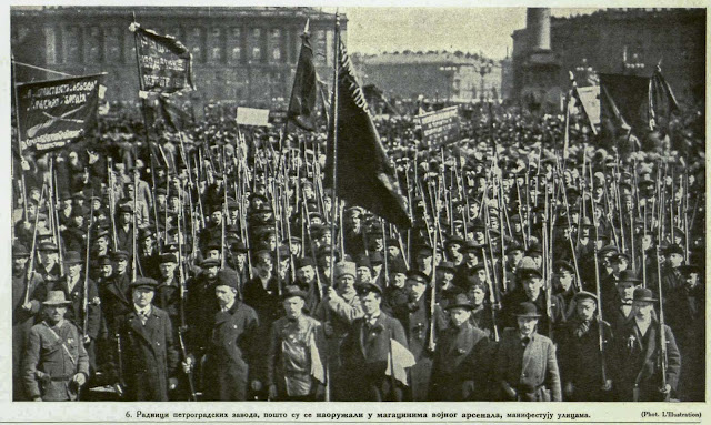 Workmen of Petrograd Industrial Concerns, after having armed themselves from the arsenal, march through the Streets.