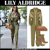 Lily Aldridge in army green jumpsuit and suede ankle boots in NYC on July 25