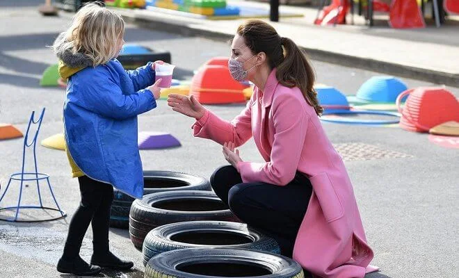 Kate Middleton wore a pink pure wool coat from Max & Co, and a pink scallop jumper from Boden