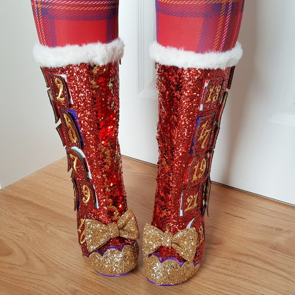 white fur top trimmed calf length boots being worn in festive theme