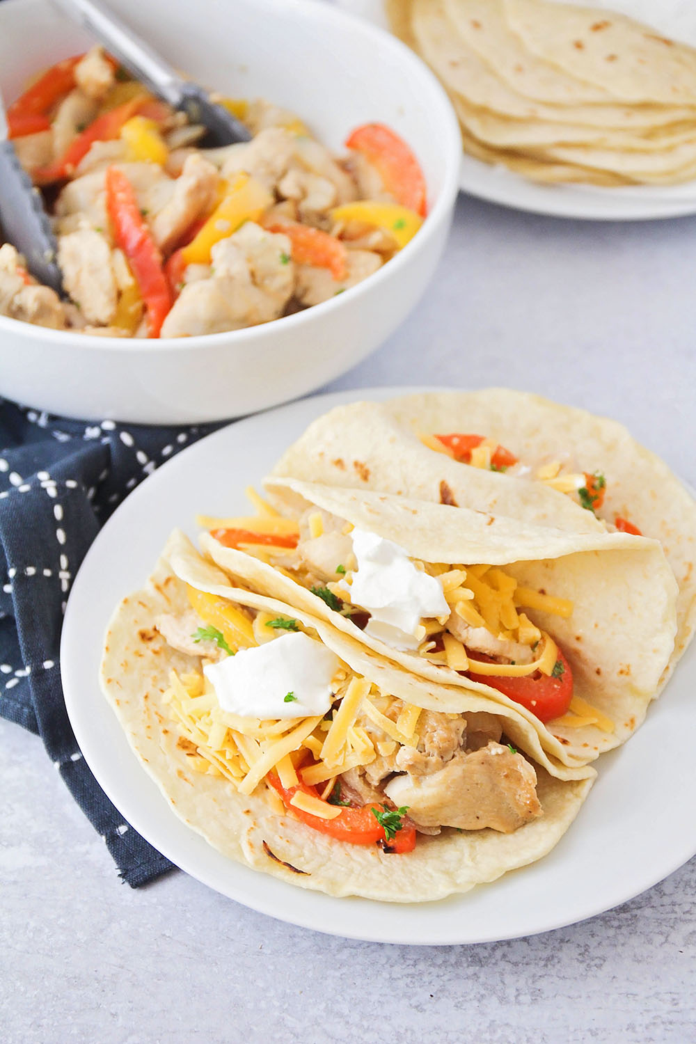 These sheet pan chicken fajitas are simple to make, and bursting with delicious flavors. It's an easy weeknight meal that's sure to please!