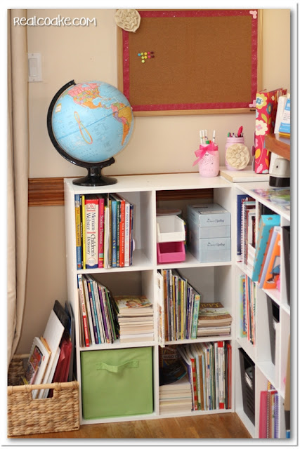 Homeschool organization ideas for organizing all the books and supplies in shelves in the living room. #Organizing #Homeschool #RealCoake