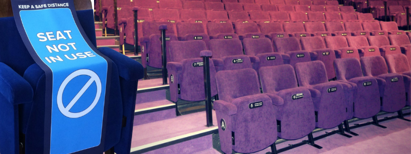 Auditorium with purple seats and close up of blue seat with social distancing seat wrap highlighting seat as out of use