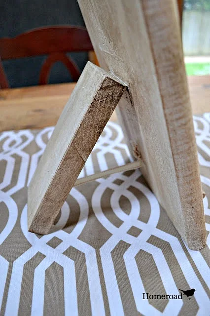 DIY ipad stand from a wooden cutting board with a wooden stand. 