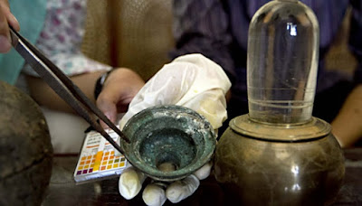 Archaeologists test the water of the Crystal Linga