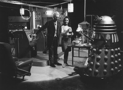 31st January 1966:  Peter Cushing (1913-1994) as Dr Who and Jill Curzon as his niece, Louise, with a dalek on the set of, 'Daleks: Invasion Earth 2150 AD' directed by Gordon Flemyng.  (Photo by McCabe/Express/Getty Images)