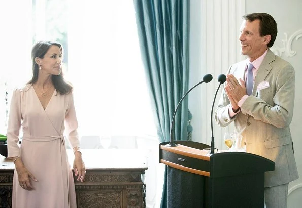 Princess Marie wore GOAT Fashion ballerina wrap dress. Prince Joachim and Princess Marie held a reception for representatives of the charities