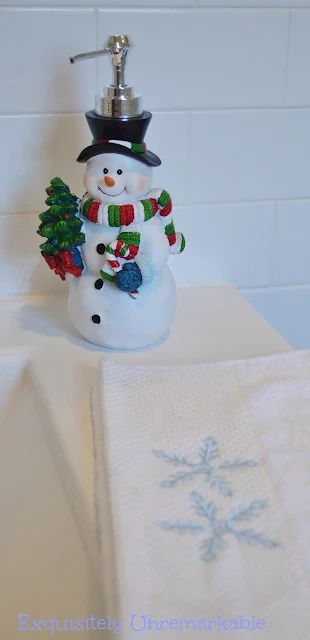 Snowman soap dispenser in the bathroom