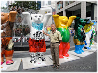 John posing with some of the United Buddy Bears at Pavilion KL