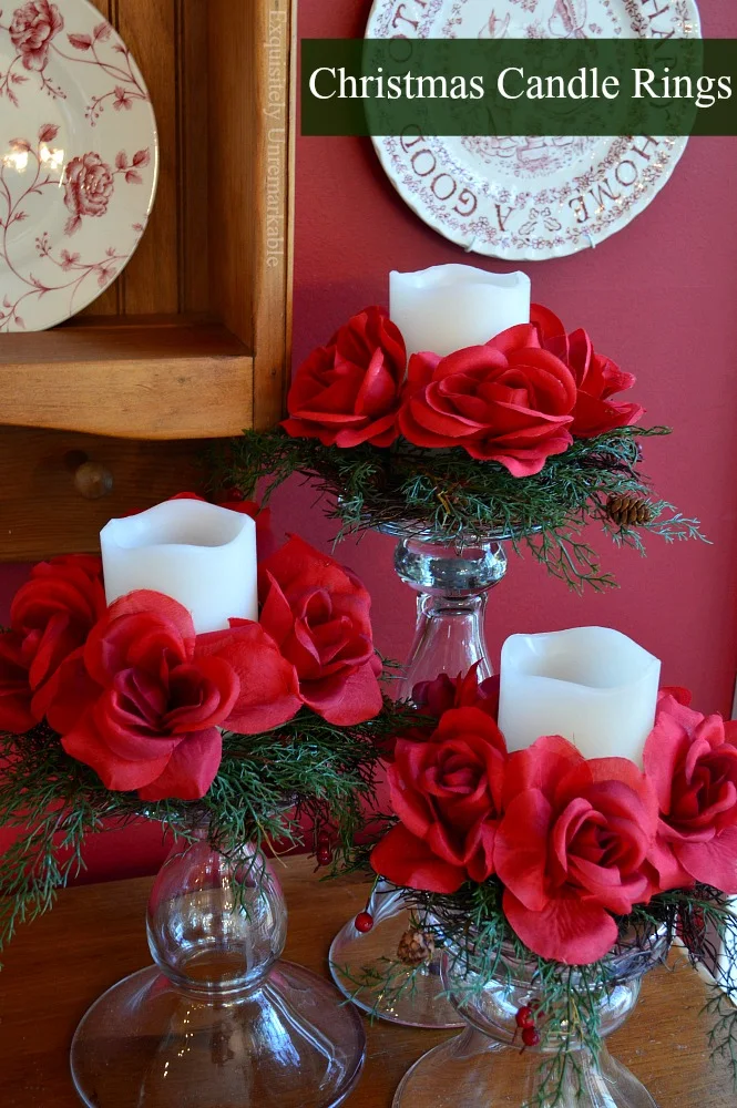 Christmas Floral and Evergreen Rings over candles on glass candle pedestals