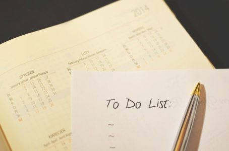 A to-do list, calendar and a pen