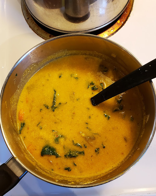 Vegan pumpkin curry soup in a pot