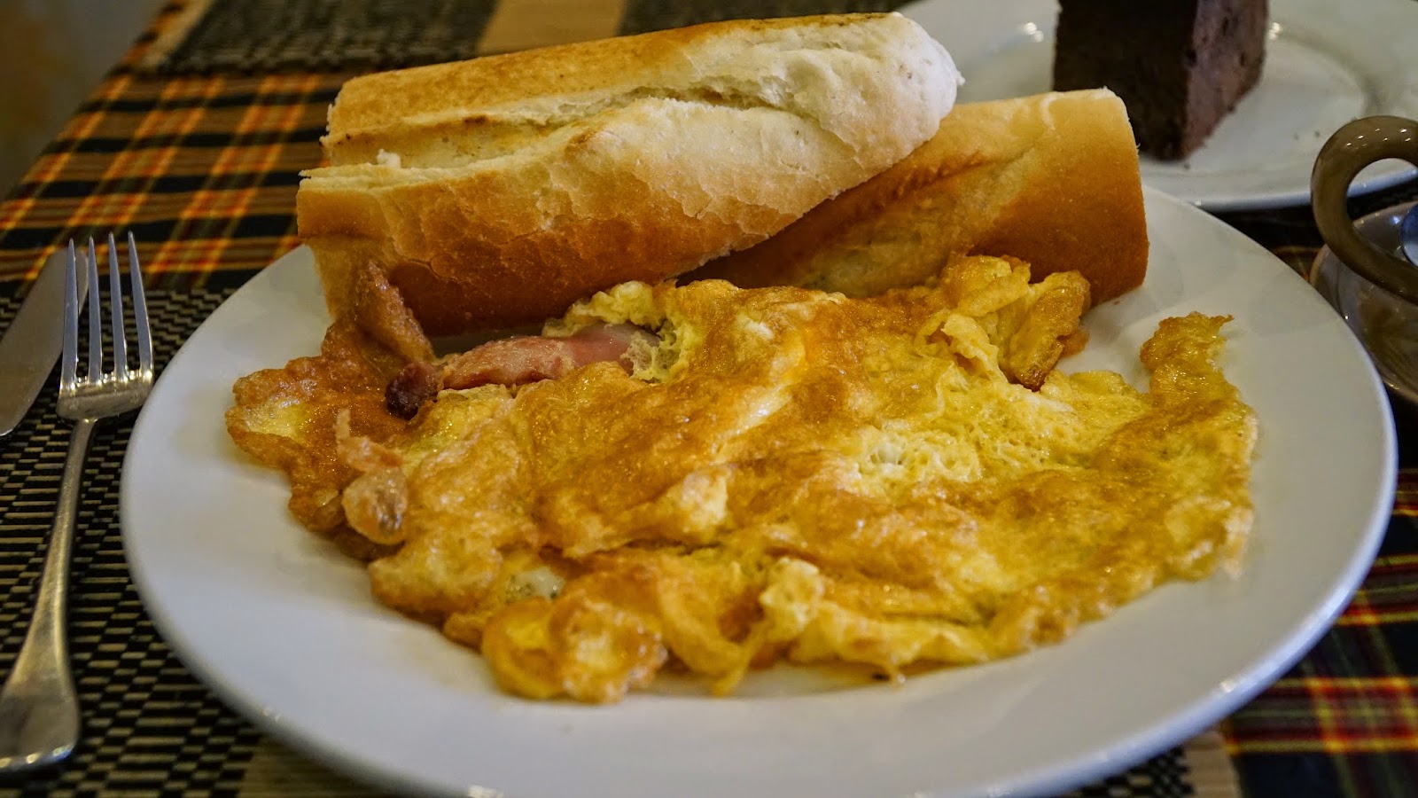 Bacon omelette with baguette for breakfast. Nice and cheap