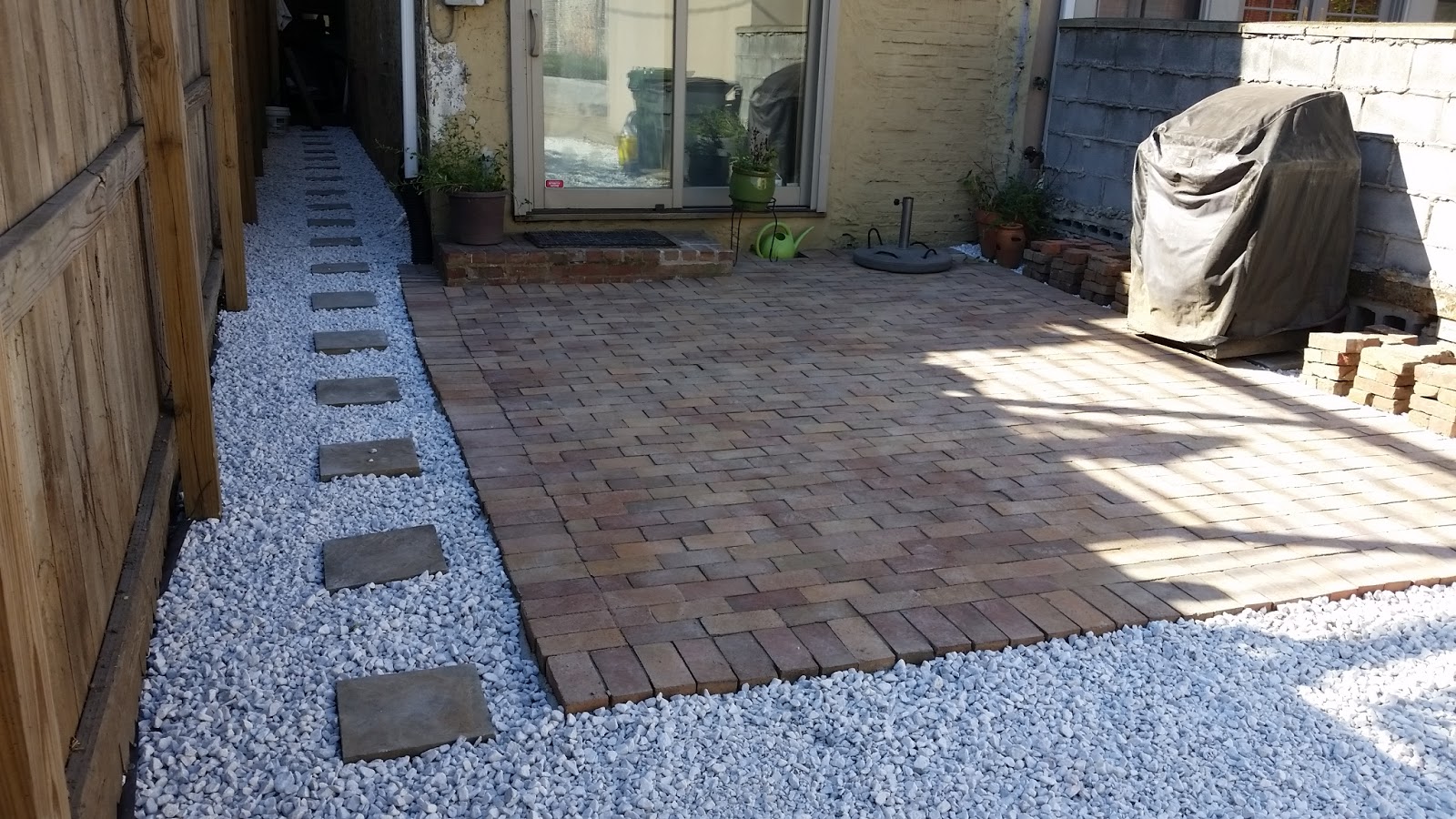 Custom Stoneworks & Design Inc. Gravel parking pad and patio in Canton