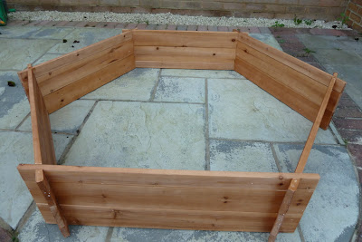 Hexagonal wooden sandpit