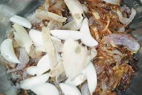 Making paste with fried onions, garlic and ginger