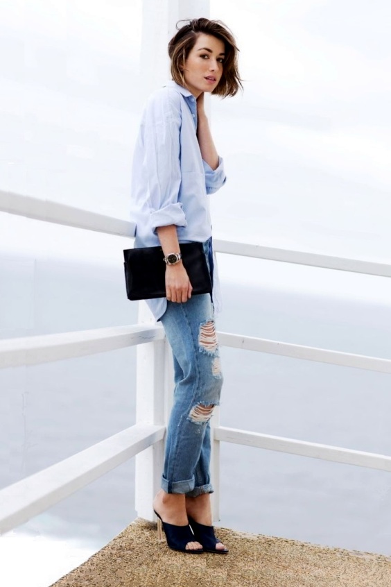 Woman wearing jeans and black mules