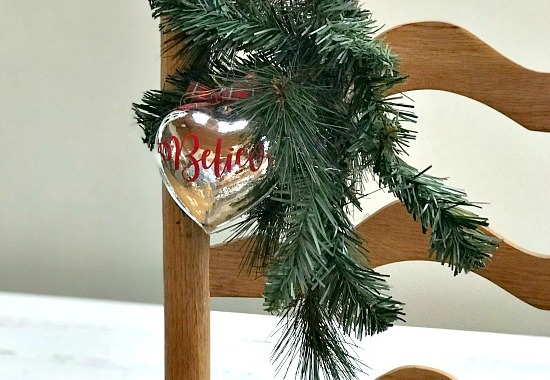 heart ornament with greens on chair
