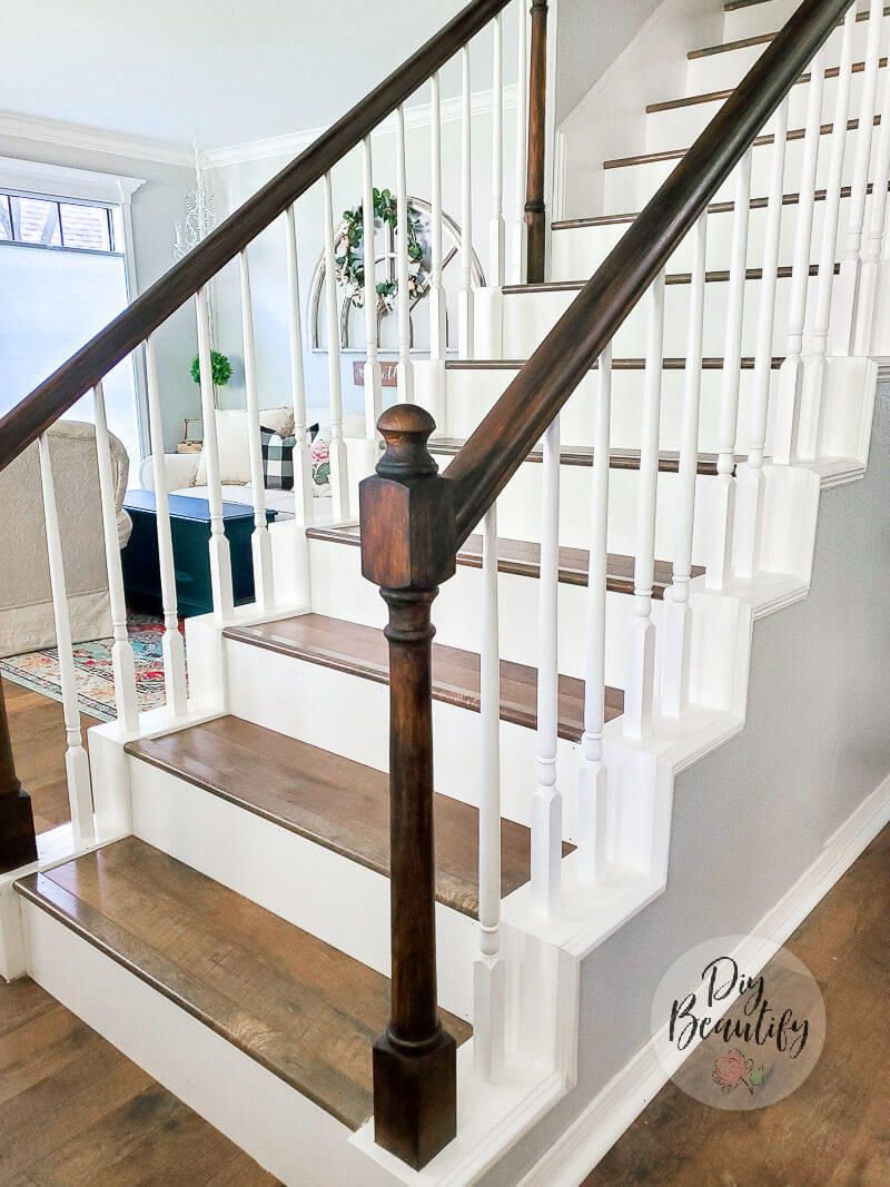 staircase with darker stained banister