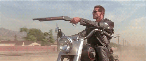Arnold Schwarzenegger fires a shotgun from a Harley Davidson, Terminator 2 