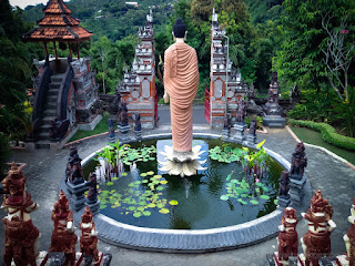 Sweet Garden Front Yard With Buddha Statue Give Blessings In The Middle Of The Lotus Pond In Bali Indonesia