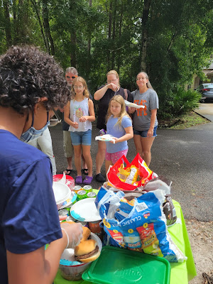 Neighbors getting food at the West Augustine pop-up location