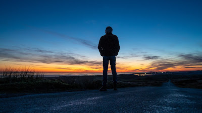 Wallpaper of a lonely man on the street at The Sunset