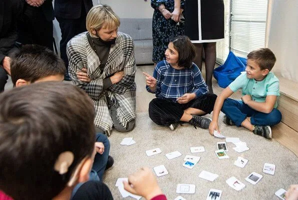 Princess Charlene visited the Olympic Village in Tbilisi and its sports facilities. Charlene wore a traford plaid fringe poncho from Loro Piana