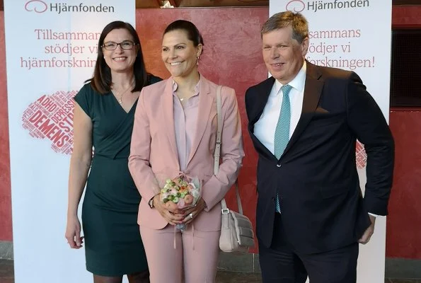 Crown Princess Victoria wore Filippa K blazer and pants. Crown Princess wore a pink pantsuit by Filippa K. Tiger of Sweden Defernex bag