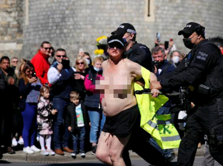 Topless woman arrested outside Windsor Castle during Prince Philip’s funeral