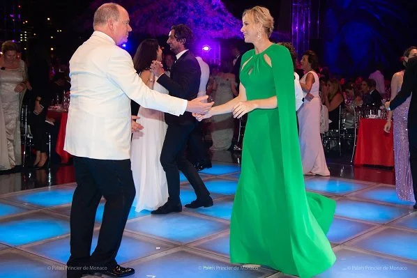 Princess Charlene wore a new green cape effect crepe gown by Marchesa. Princess Charlene wore Marchesa notte green cape effect crepe gown