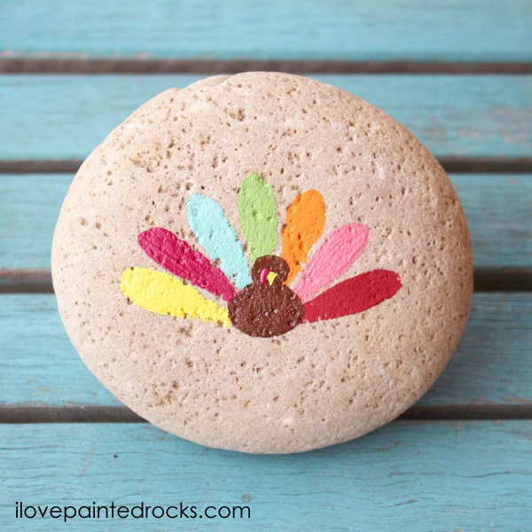simple and colorful turkey painted rock for thanksgiving