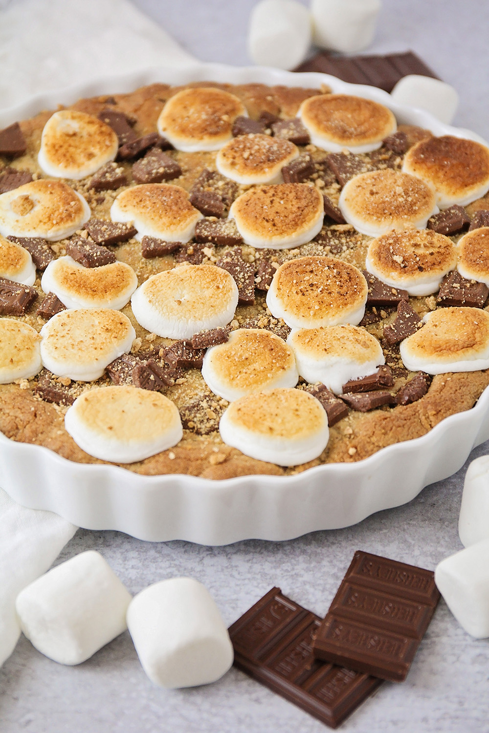This decadent and delicious s'mores cookie cake is so easy to make!