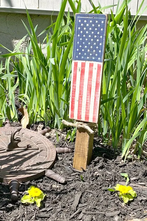Rustic painted American flag in the garden