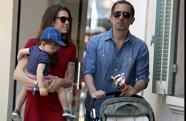 Charlotte Casiraghi and Gad Elmaleh with their baby Raphael walking and shopping in the streets of Saint-Tropez, France