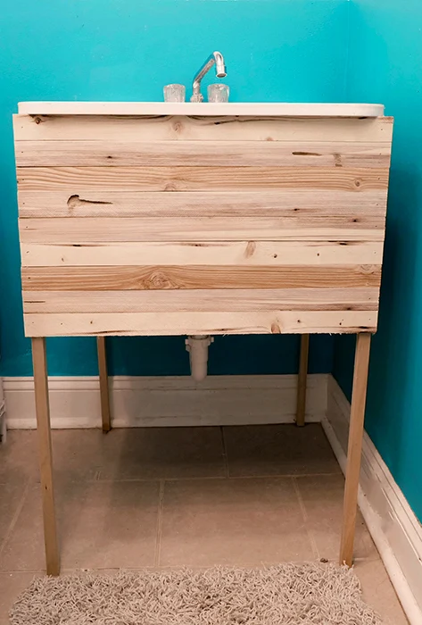 hidden laundry sink by wood lath and wood dowels