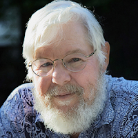 Photographer Ted Orland, with a big white beard and wearing a blue shirt