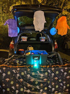 Our large Trunk N' Treat spider, with a hidden Flyfour under the table