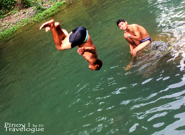 My cousin back dives into the river