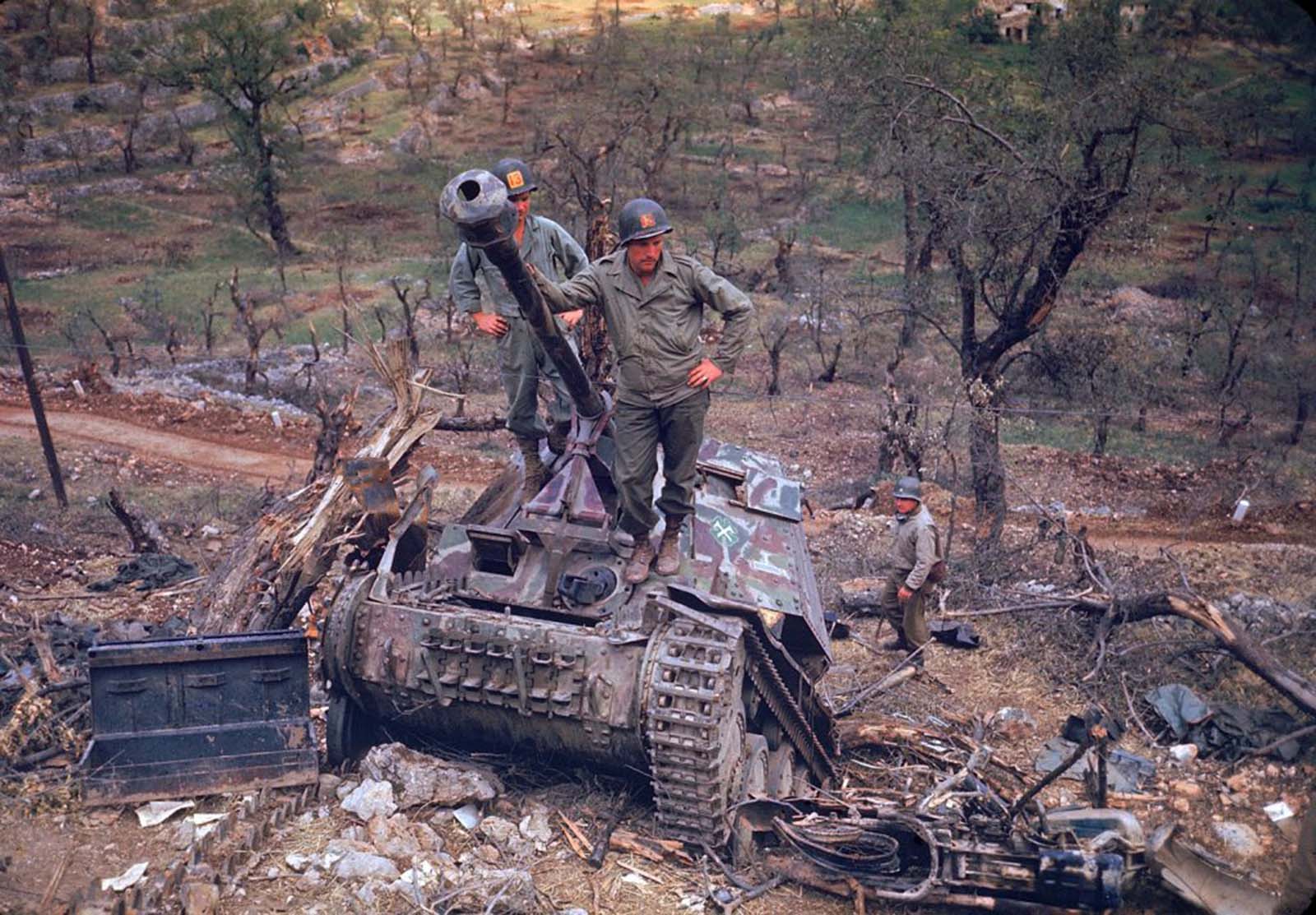 American troops looked over German armor destroyed during the drive towards Rome, 1944.