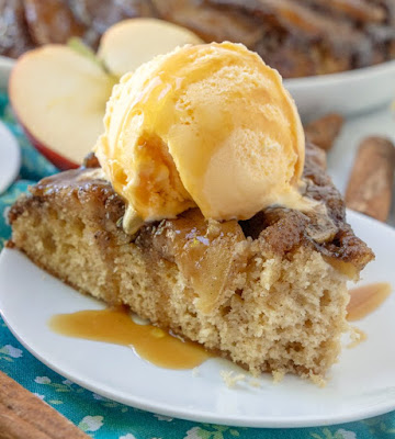 slice of caramel apple skillet cake with bite missing from the end